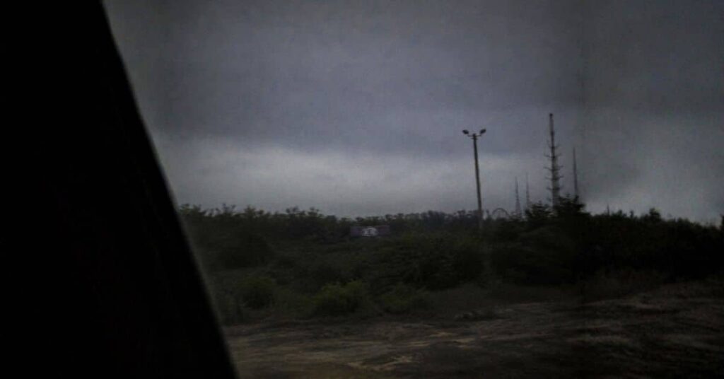 Grainy nighttime image allegedly showing a distant K&B sign near the abandoned Six Flags site in New Orleans East