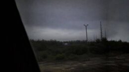 Grainy nighttime image allegedly showing a distant K&B sign near the abandoned Six Flags site in New Orleans East
