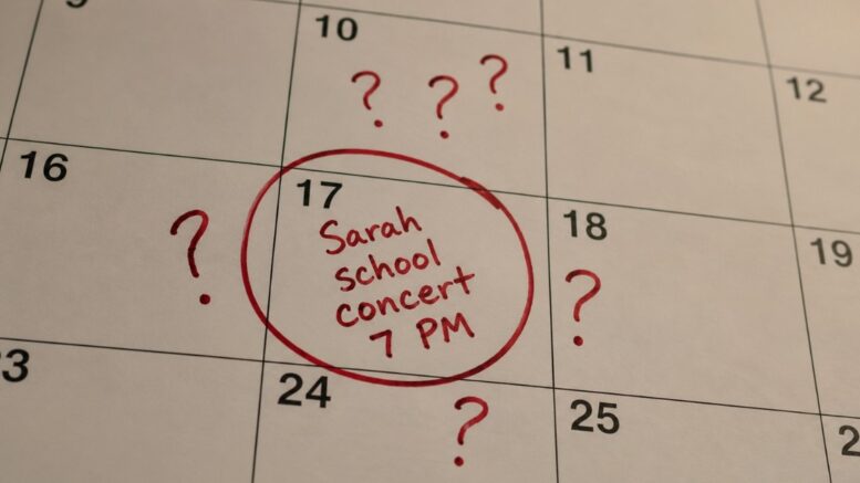 Calendar date circled in red marker with “Sarah school concert 7 PM” handwritten beside several skeptical question marks