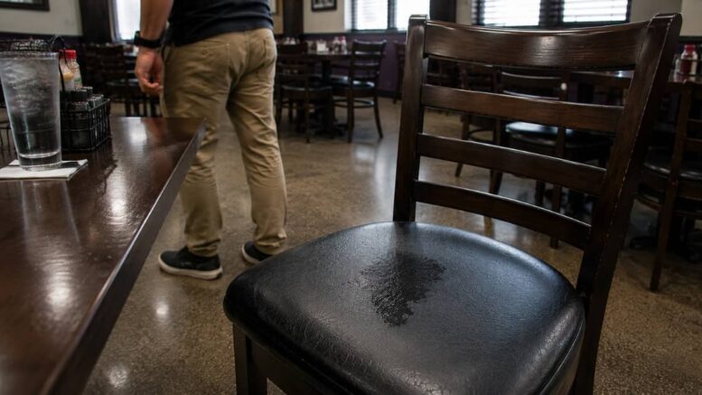 New Orleans butt sweat mark left on a restaurant chair after a man stands up