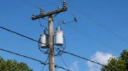 Utility pole and power lines in New Orleans during a widespread power outage.